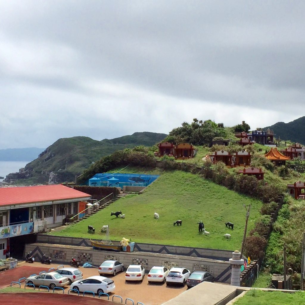 To the left, an elementary school. To the middle, some fake cows. To the right....some ancient burial grave sites.