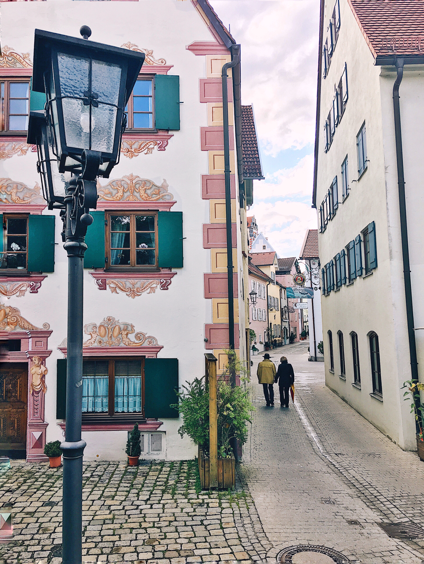 Old couple walking through Wurzburg